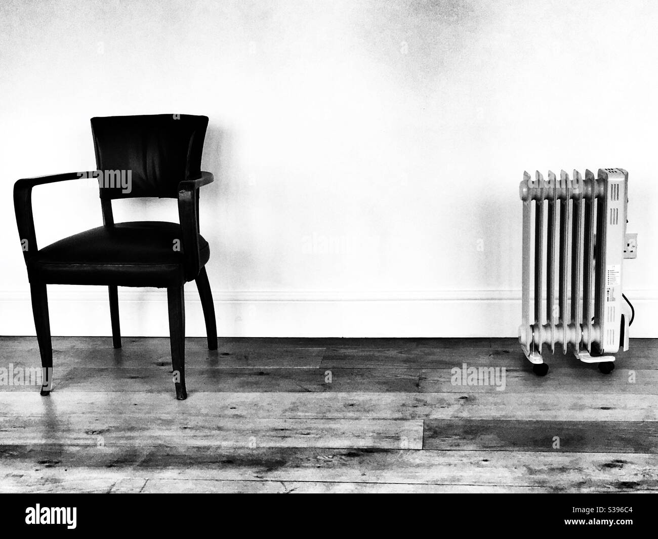 Chair and radiator Stock Photo - Alamy