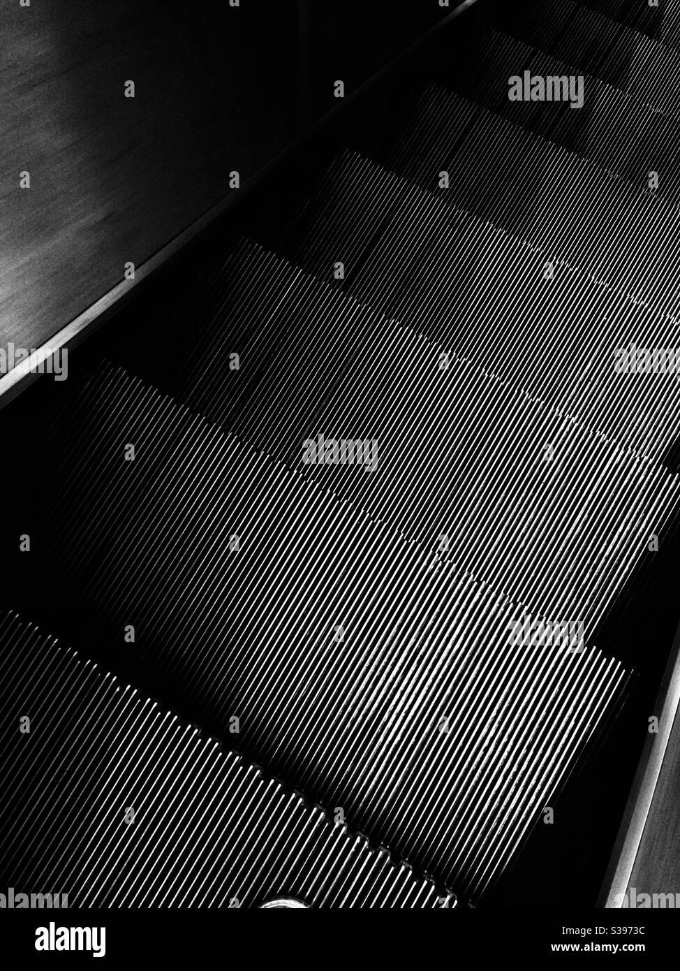 Metal ridged or ribbed steps on escalator - Smartphone Captured Stock Image Metal ridged or ribbed steps on escalator - Smartphone Captured Stock Image