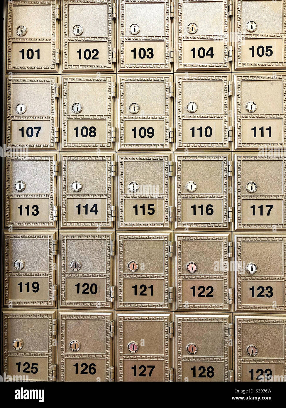 Wall of mailboxes with numbers and locks - Smartphone Captured Stock Image