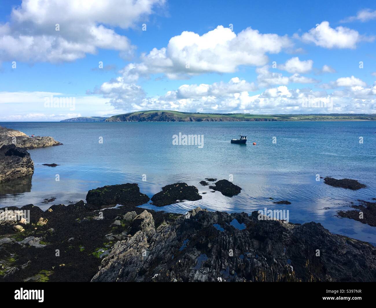 Fishing boat in a calm seascape - Smartphone Captured Stock Image