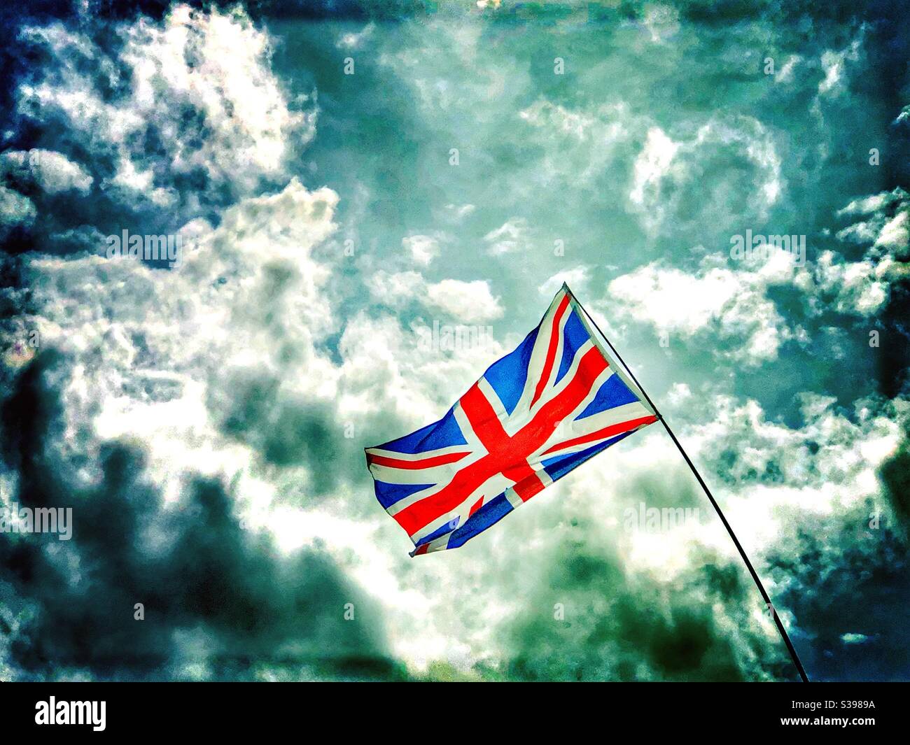 Union Jack United Kingdom flag against dramatic sky - Smartphone Captured Stock Image