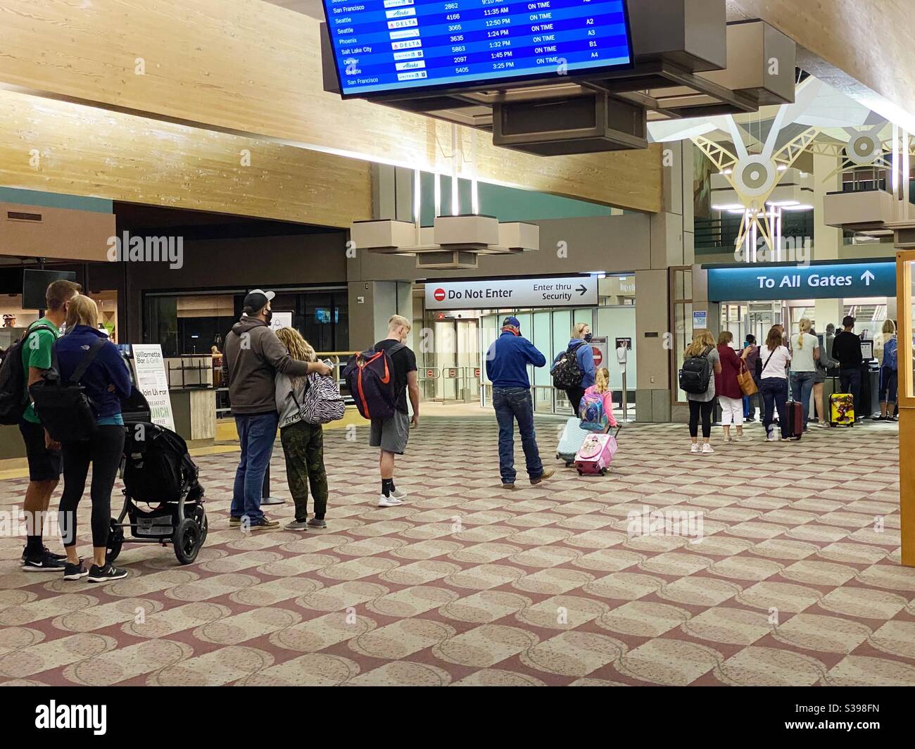 People social distancing in security check line at the Eugene, Oregon airport Stock Photo Alamy