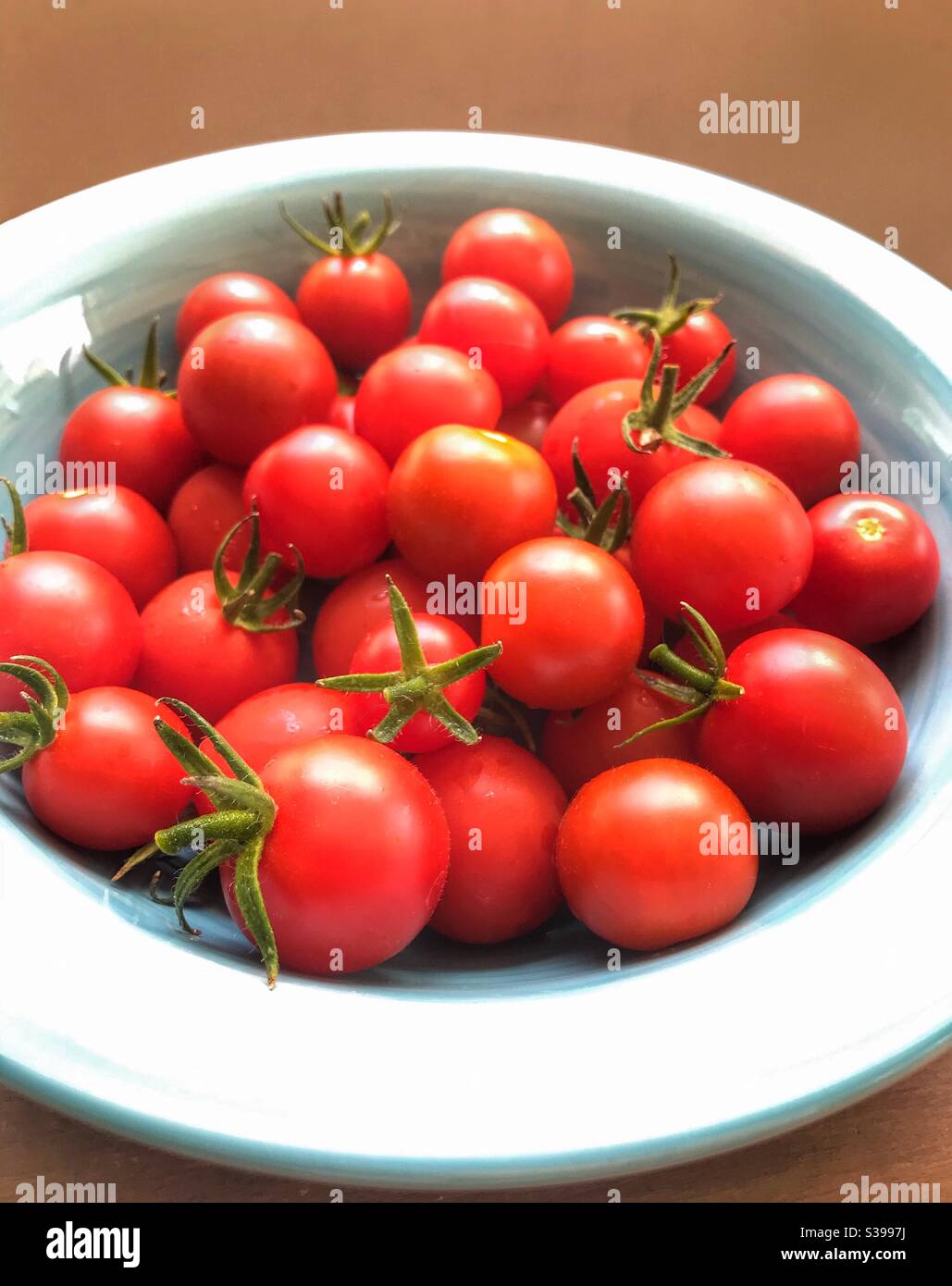 Cherry tomatoes in a bowl Stock Photo