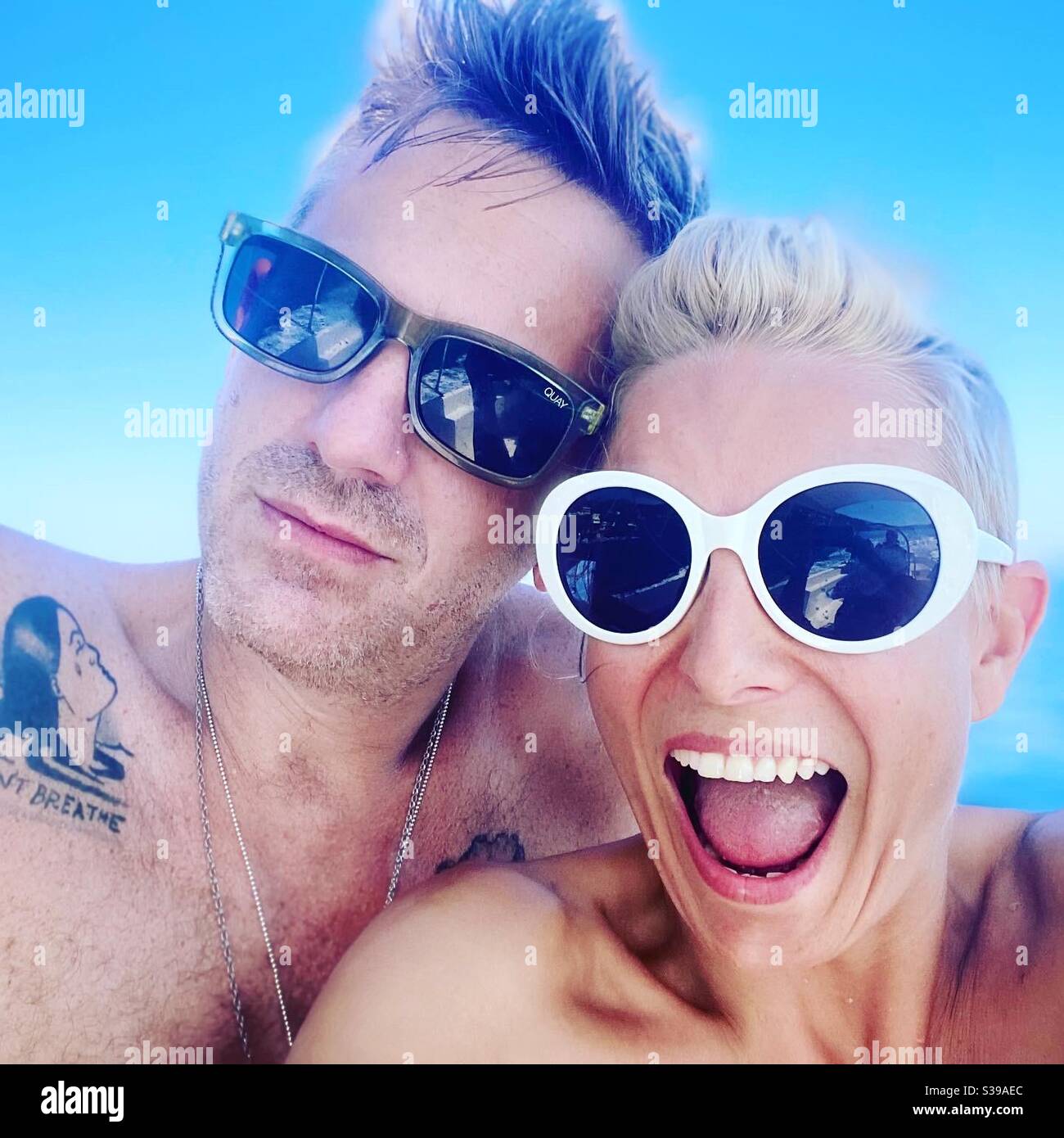 Man and woman blue sky - Smartphone Captured Stock Image