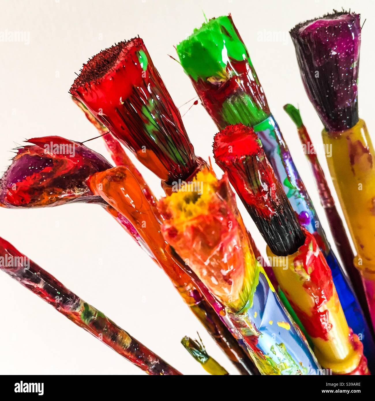 Messy paintbrushes on white background - Smartphone Captured Stock Image