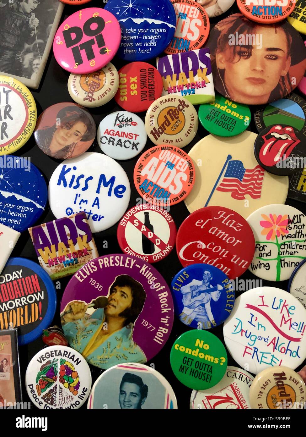A collection of various political buttons and pins including rock ‘n’ roll personalities. - Smartphone Captured Stock Image