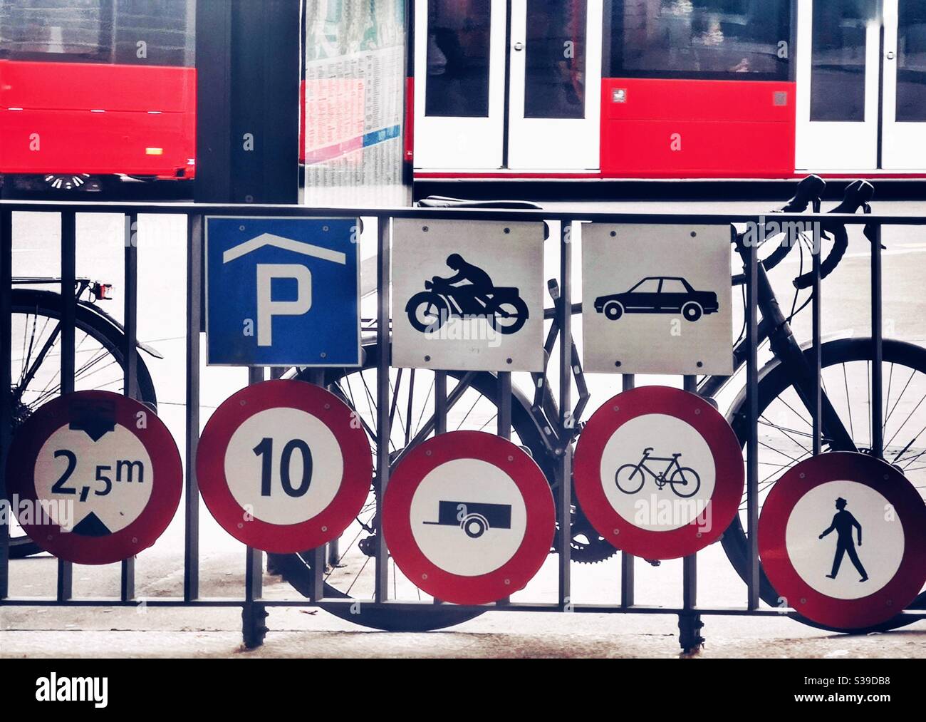 A cluster of traffic signs at entrance to an underground car park, Bern, Switzerland - Smartphone Captured Stock Image