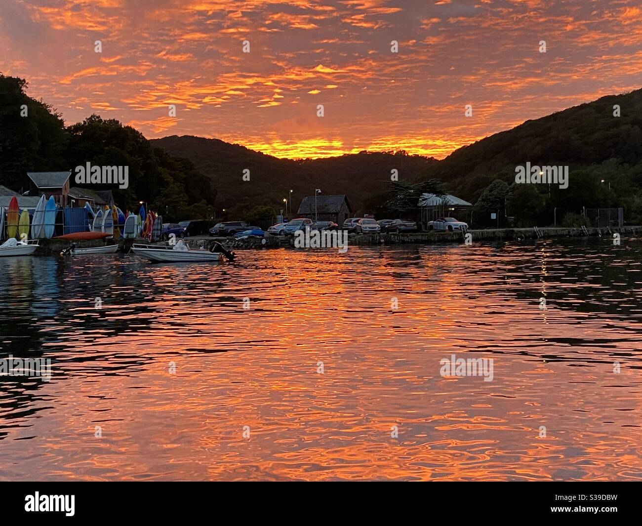 Looe estuary Cornwall sunset with pink reflections in the water - Smartphone Captured Stock Image