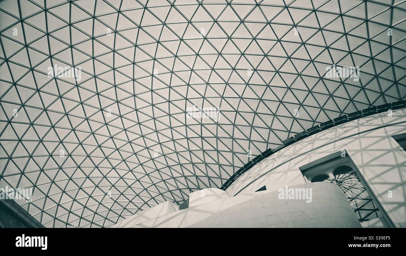Black and white photograph of the interior roof structure of the British Museum in London. - Smartphone Captured Stock Image