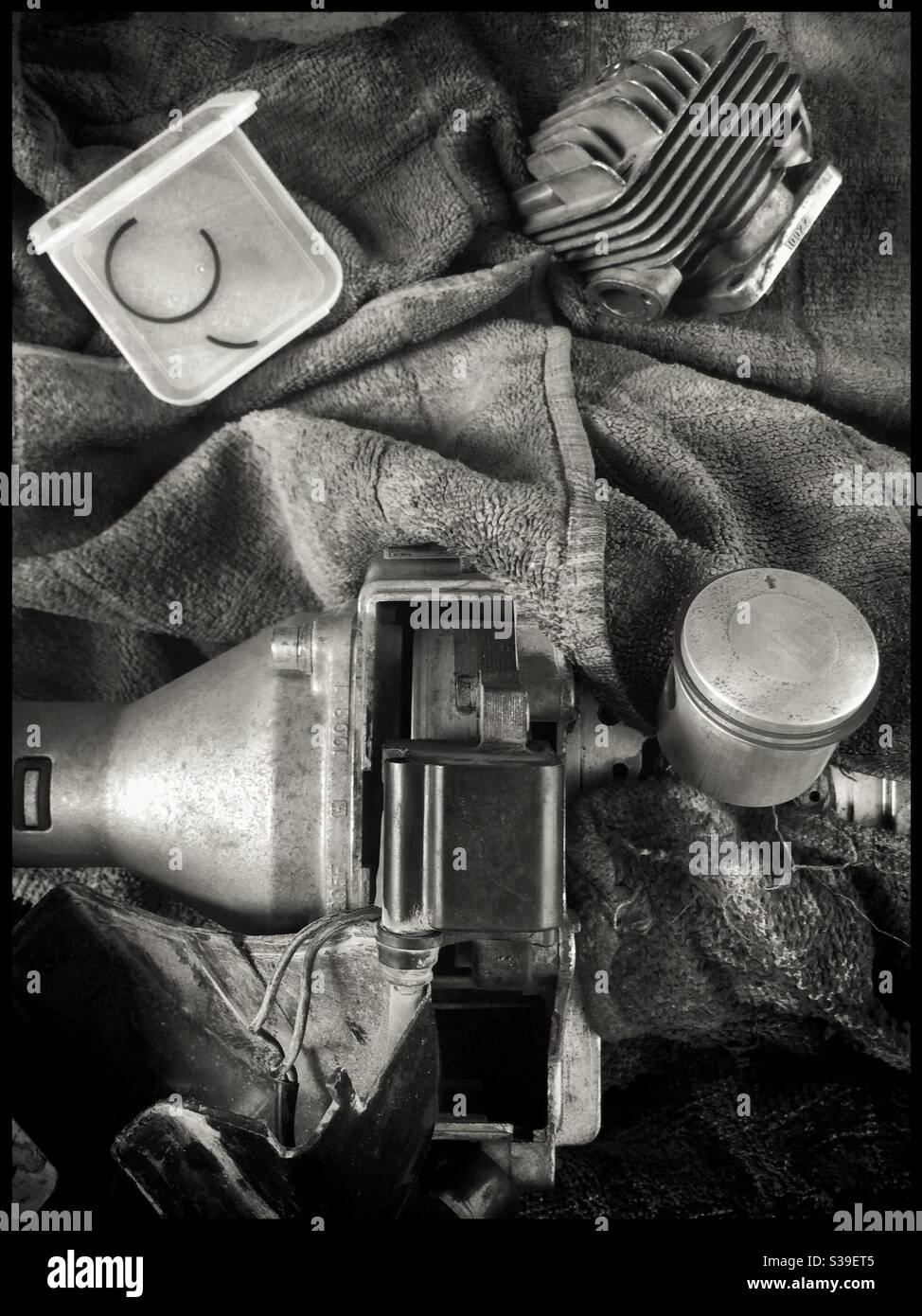 Repairing a 2 stroke engine, Catalonia, Spain. - Smartphone Captured Stock Image