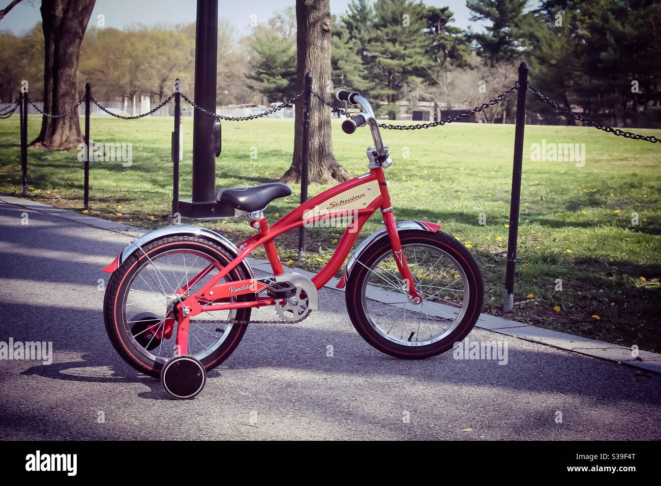 red bike with stabilisers