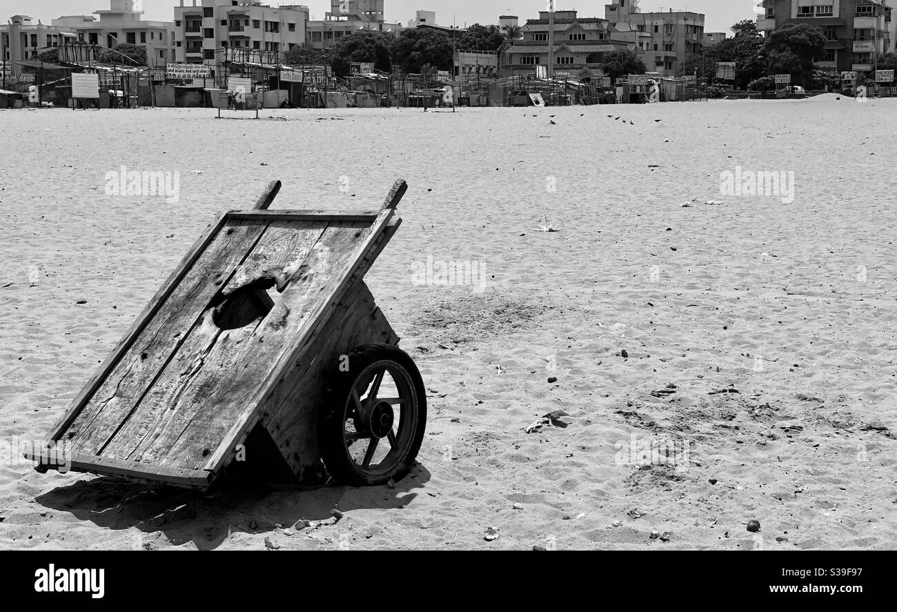 Broken wheelbarrow in beach, abandoned, black and white image, Chennai, TamilNadu, India Stock Photo