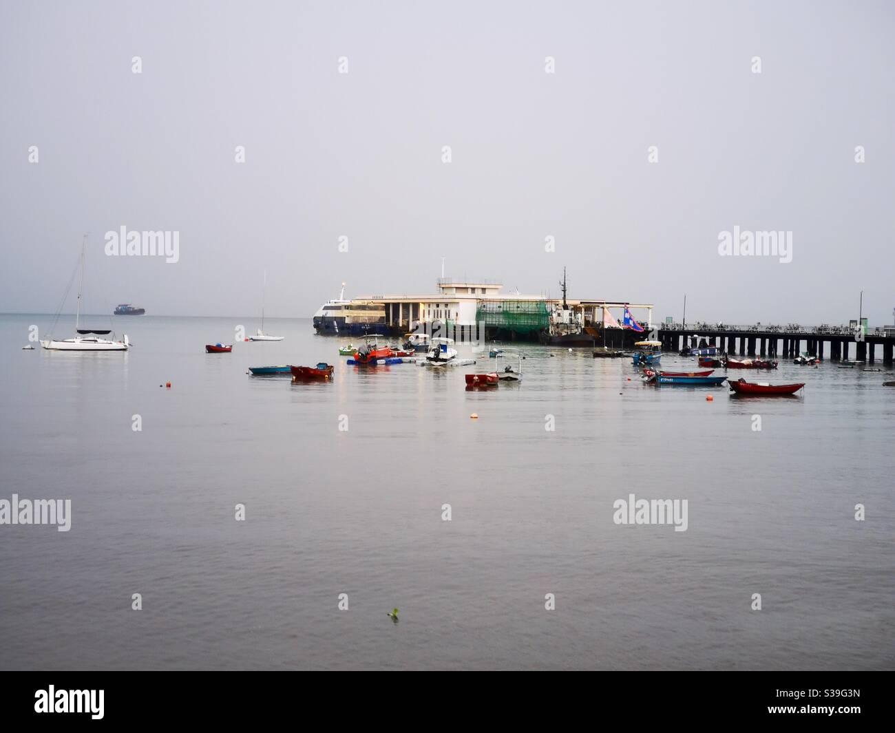 Yung Shue Wan pier in Lamma island in Hong Kong. - Smartphone Captured Stock Image