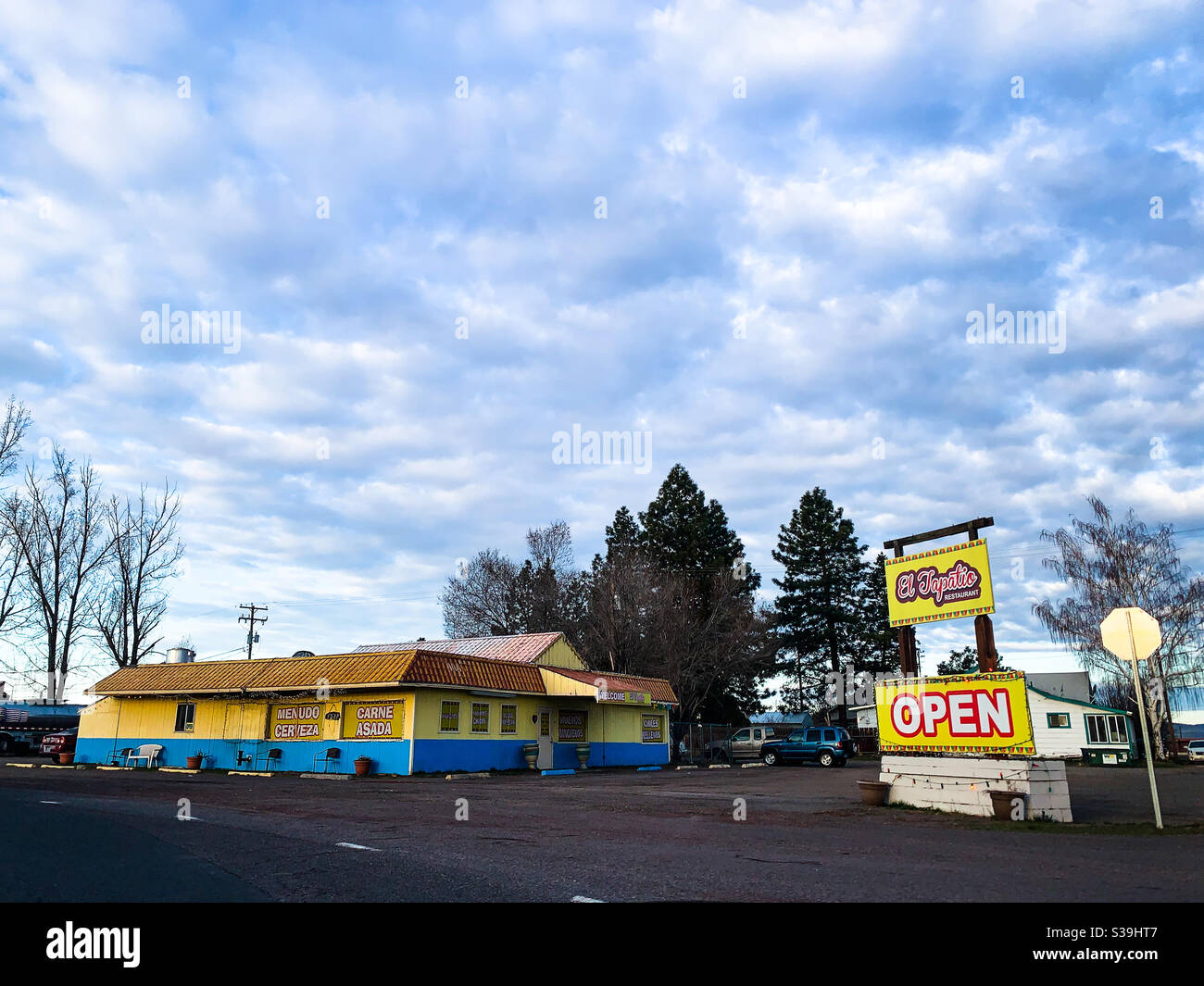 Small town restaurant closed but with open sign, in the early morning light. - Smartphone Captured Stock Image