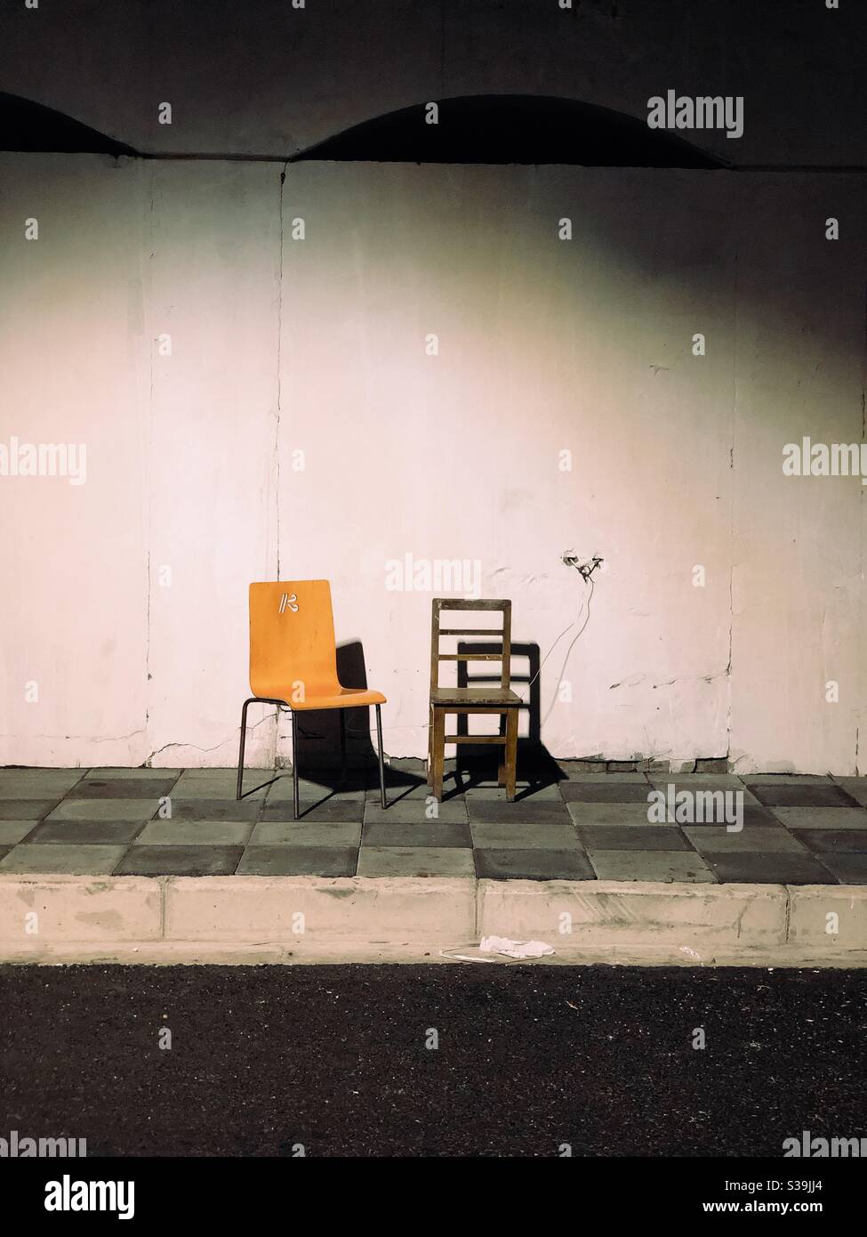 Abandoned chairs under the bridge. Stock Photo