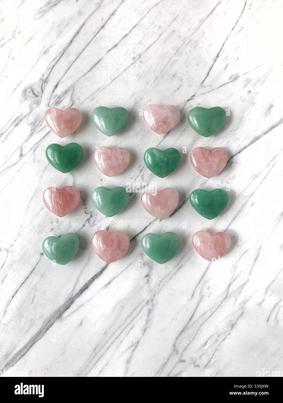 Rows of pink and green hearts Stock Photo