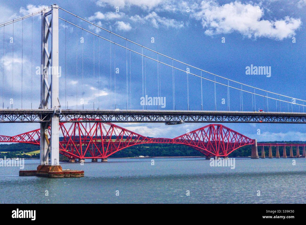 Forth Road bridge and Forth bridge over the River Forth in Edinburgh, Scotland. - Smartphone Captured Stock Image