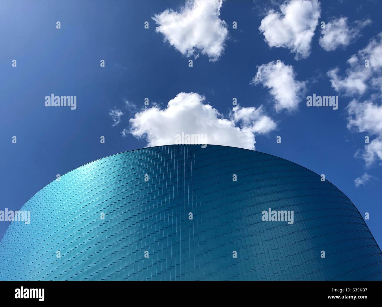 Part of the characteristic circular facade of The Wave, an indoor water park in Coventry, West Midlands, UK. - Smartphone Captured Stock Image