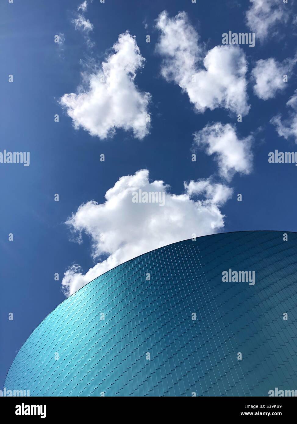 Part of the characteristic circular facade of The Wave, an indoor water park in Coventry, West Midlands, UK. - Smartphone Captured Stock Image