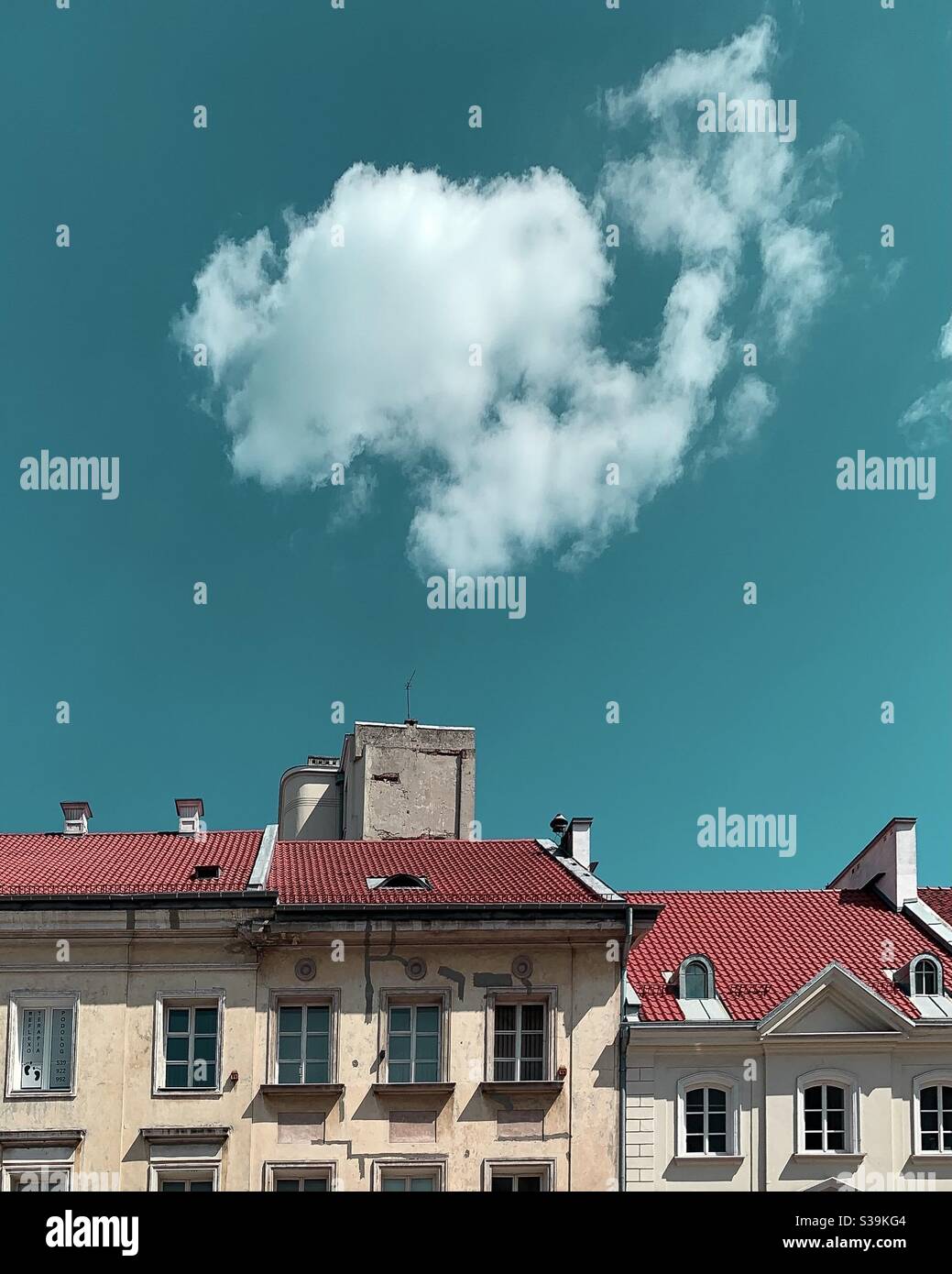 A Cloud over an old town building Stock Photo