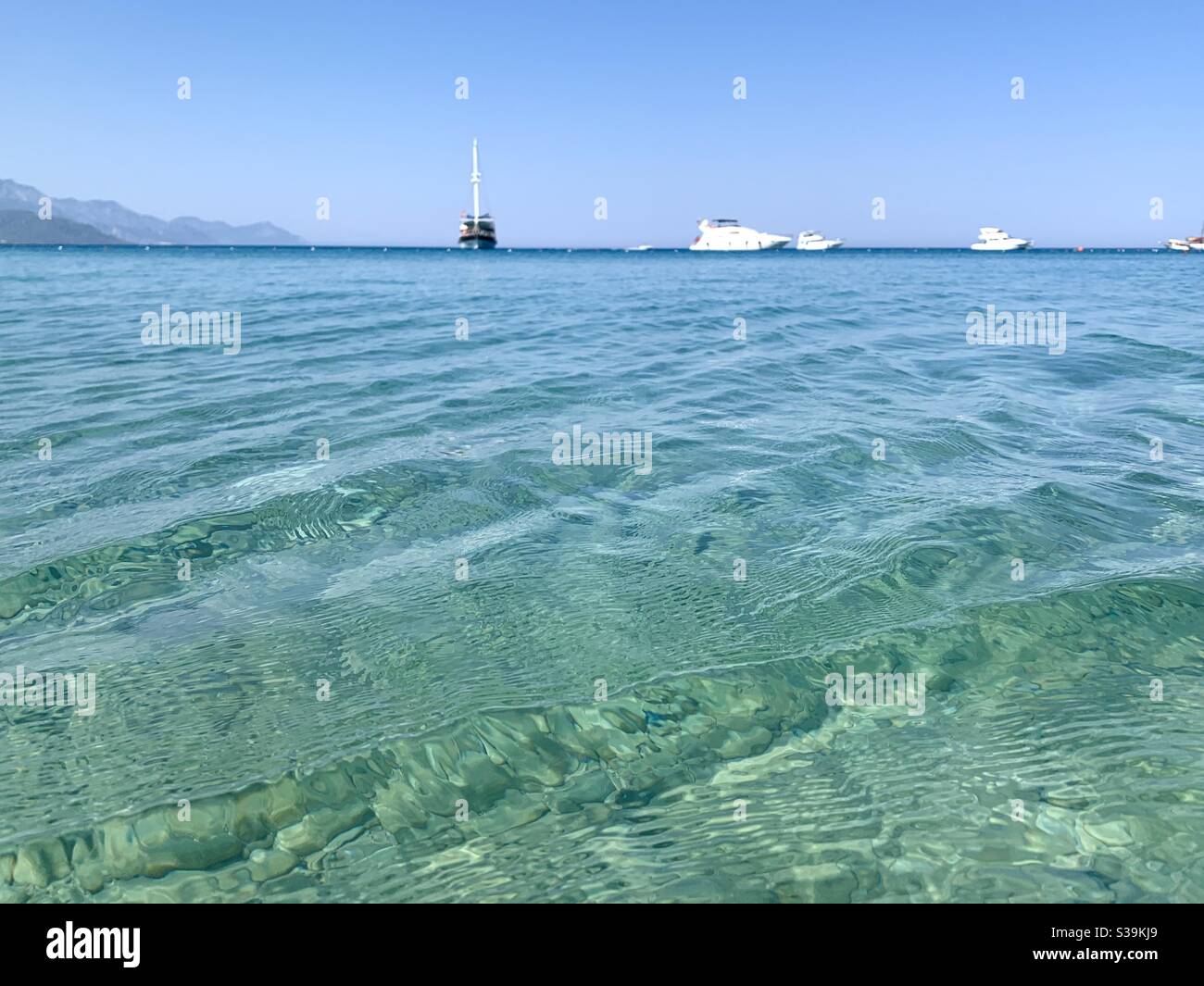 Clear blue water with a blue horizon - Smartphone Captured Stock Image