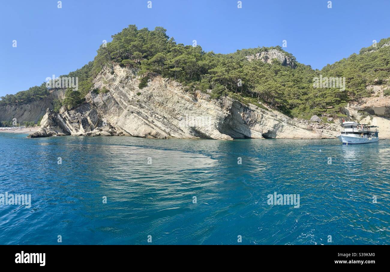 Coastline of Kemer Antalya turquoise water and rock formations - Smartphone Captured Stock Image