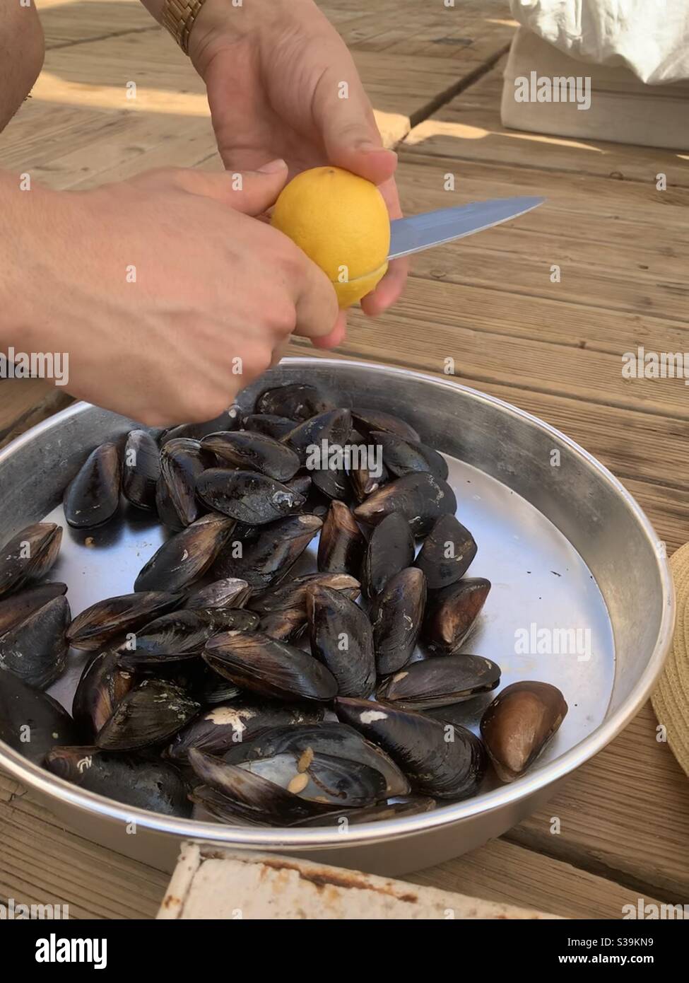Man selling stuffed mussels at Belem beach turkey - Smartphone Captured Stock Image