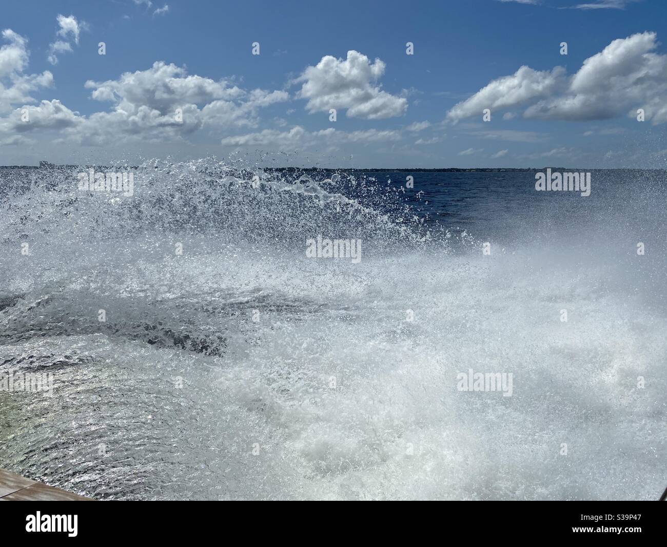 Motion boat spray over blue Gulf of Mexico water - Smartphone Captured Stock Image