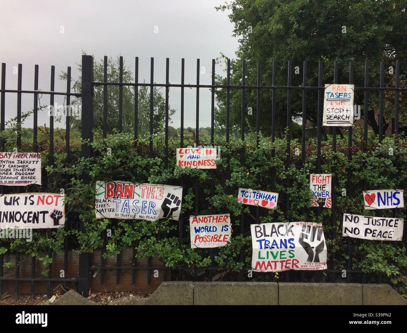 Placards attached to the railings of Lordship Recreation Ground in Tottenham, London, after a Black Lives Matter protest. Stock Photo