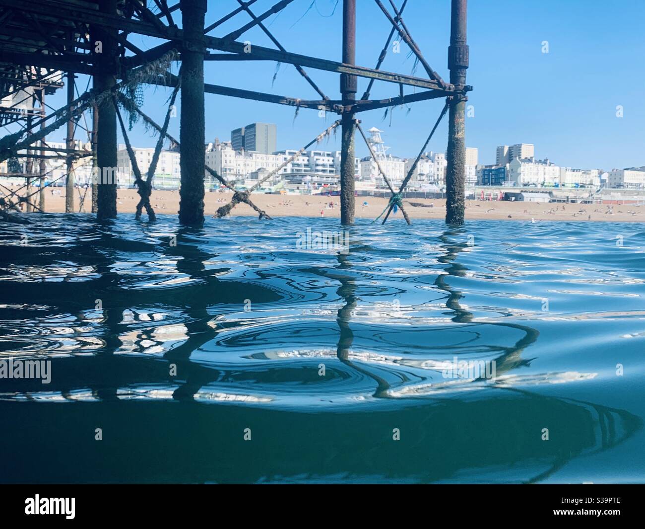 View towards Brighton beach from under the pier - Smartphone Captured Stock Image