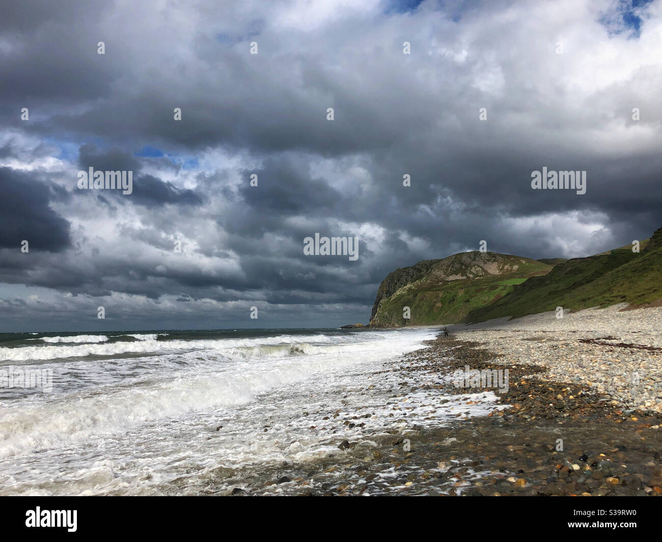 Pistyll beach, Llyn peninsula, North Wales with heavy stormy sky over a rough sea, August. - Smartphone Captured Stock Image