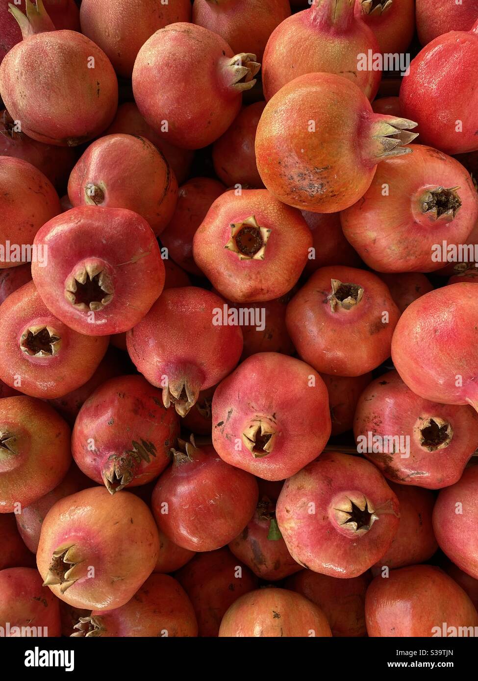 Pomegranates on sale at a market Stock Photo