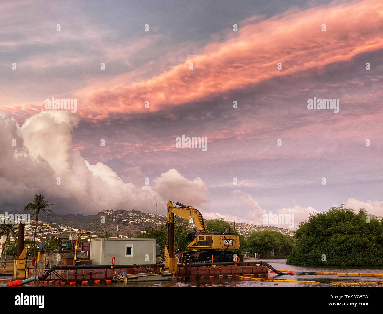 Dredging platform on the Ala Wai Canal in Honolulu, Hawaii at sunset - Smartphone Captured Stock Image