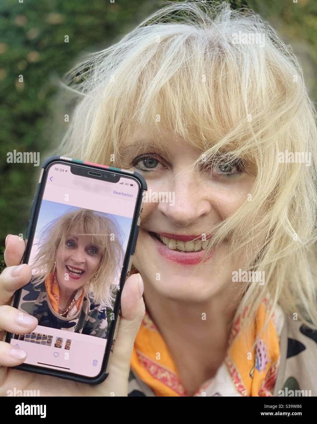 In Mobile Phone Screen and in Reality. - Smartphone Captured Stock Image