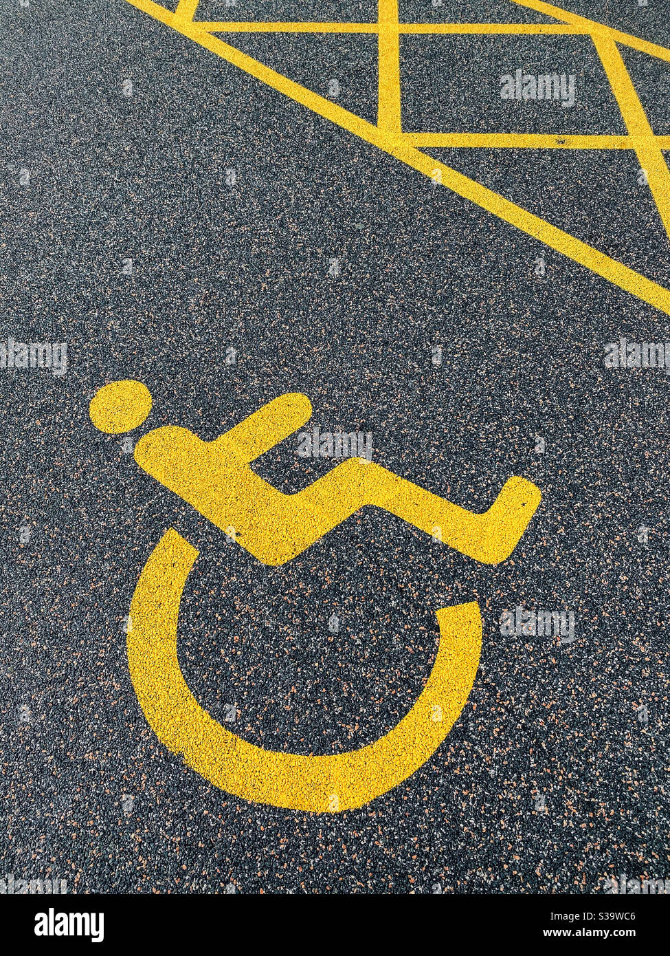 The universal sign of an area reserved for people with a disability. In this case possibly a wheelchair user who requires easy access to the shops. Acknowledgement of a mobility impairment. Photo ©️ - Smartphone Captured Stock Image