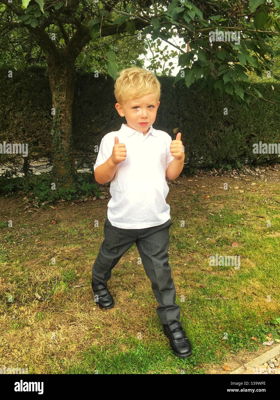 Four year old boy ready for his first day at school, Hampshire, England, United Kingdom. Stock Photo