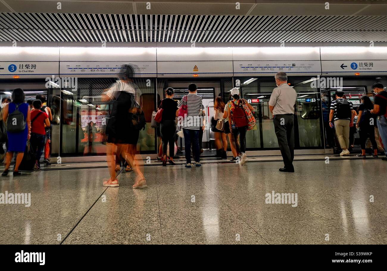 Passengers walking on the platform of the MTR central station in Hong Kong. - Smartphone Captured Stock Image