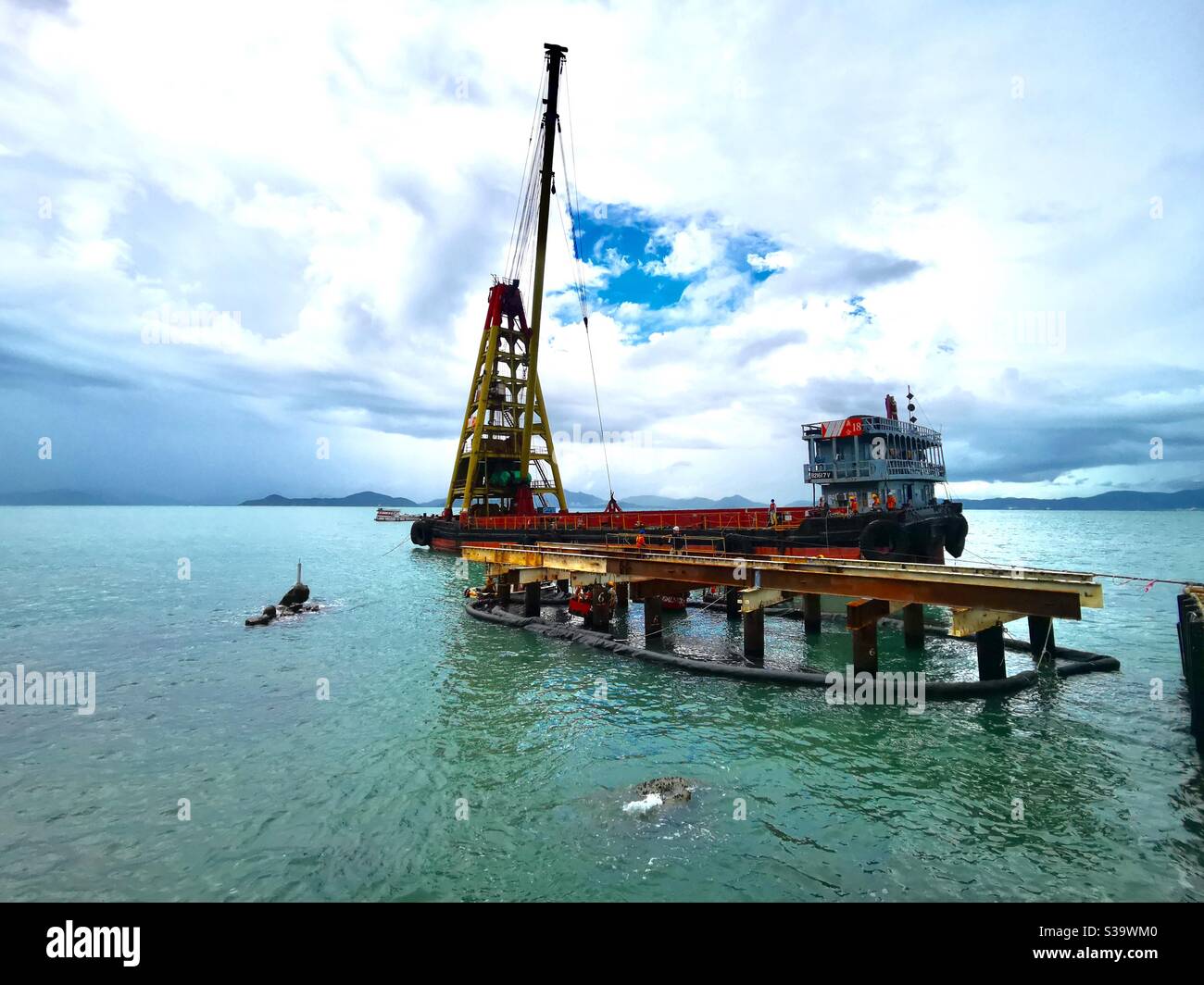 A barge ship at the pak kok ferry pier expansion project. - Smartphone Captured Stock Image