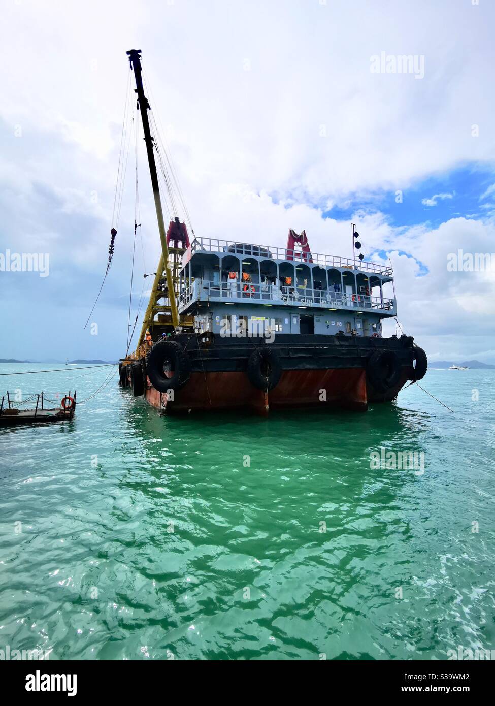 A barge ship at the pak kok ferry pier expansion project. - Smartphone Captured Stock Image