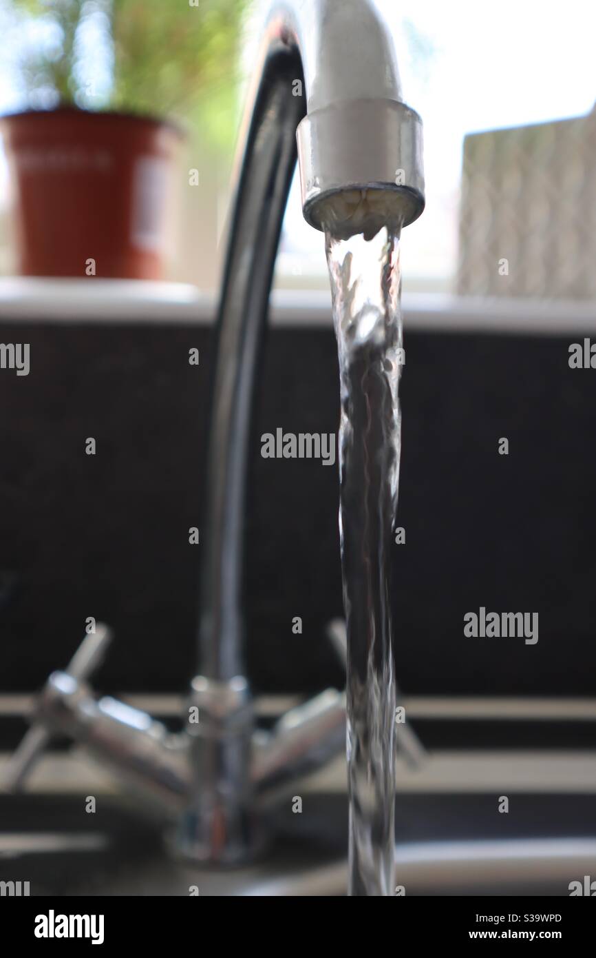 Running water from a kitchen tap Stock Photo Alamy