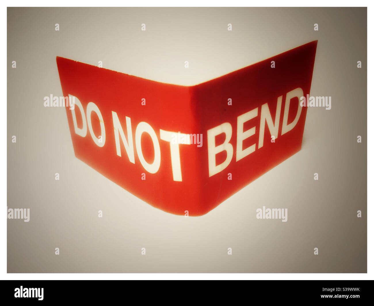 DO NOT BEND sign, bent - Smartphone Captured Stock Image