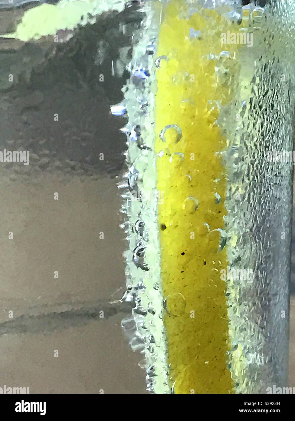 Lemon slice in sparkling water - Smartphone Captured Stock Image