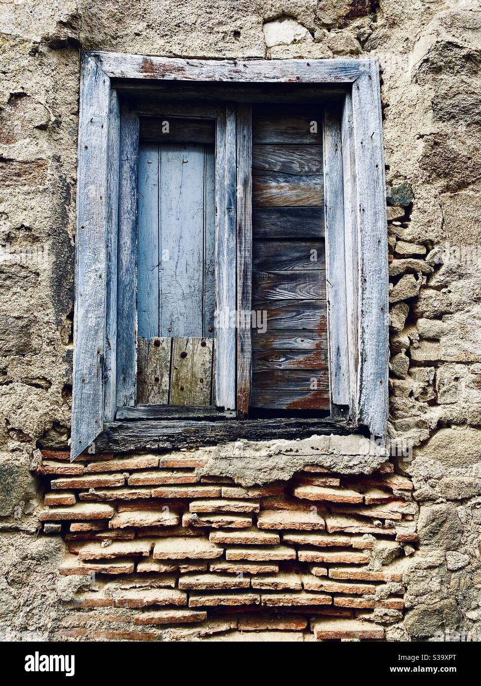 Derelict window and brickwork Stock Photo