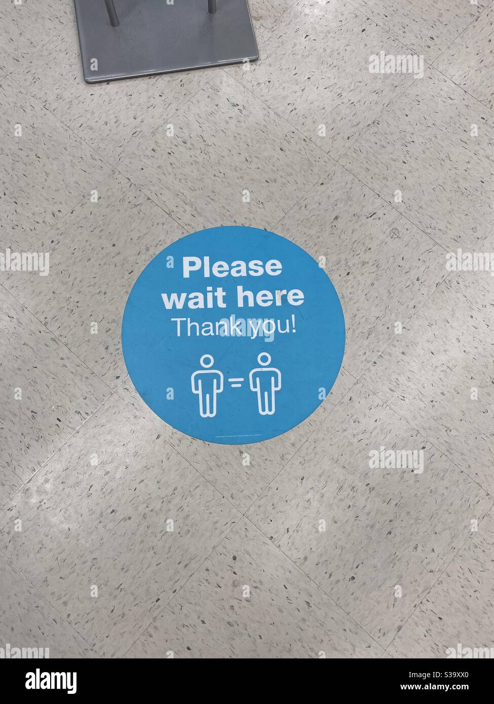 Social distancing symbol on the floor due to Covid-19 virus - Smartphone Captured Stock Image