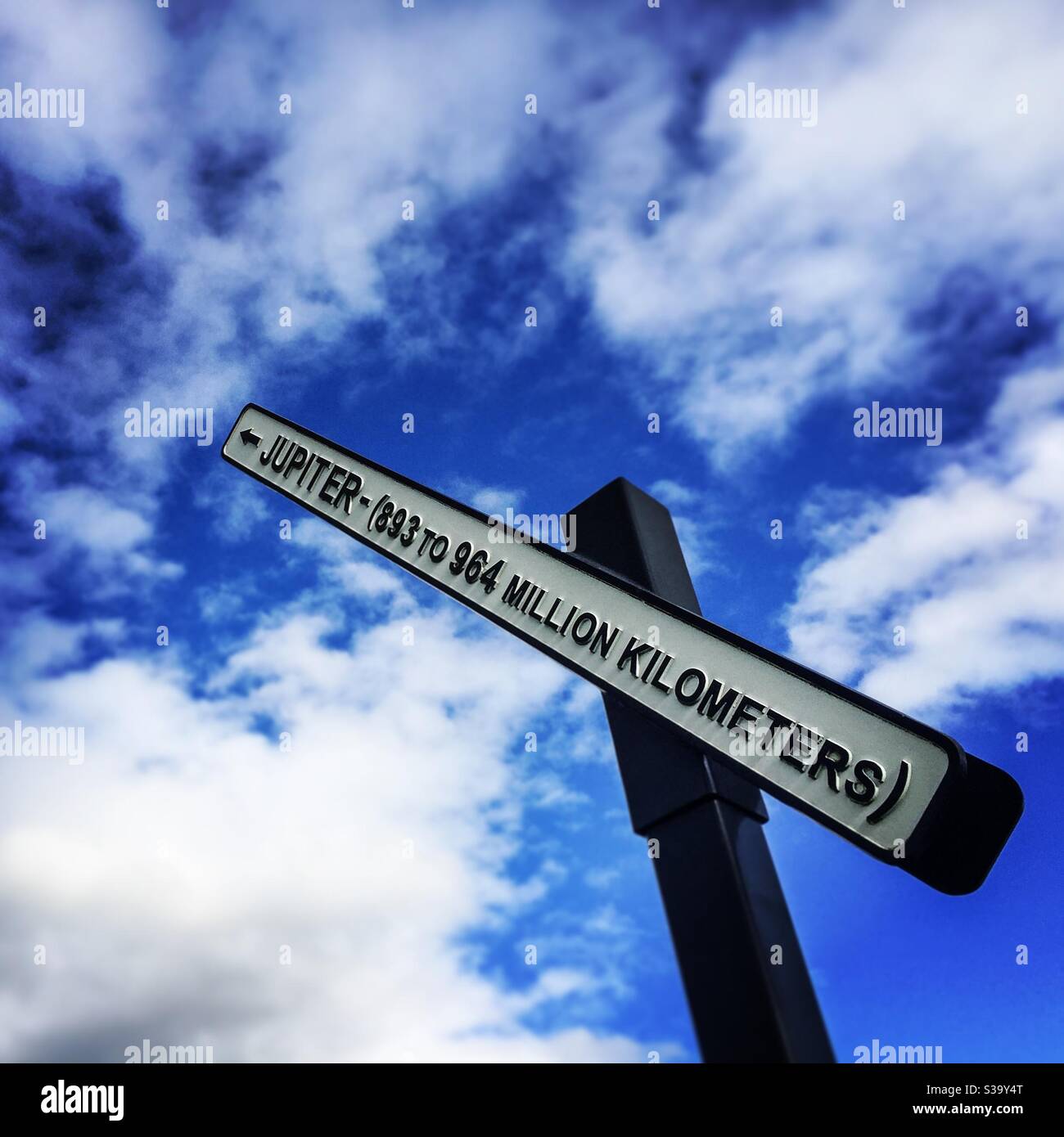 A sign showing the distance from Planet Earth to Jupiter at Jupiter Artland near Edinburgh, Scotland - Smartphone Captured Stock Image