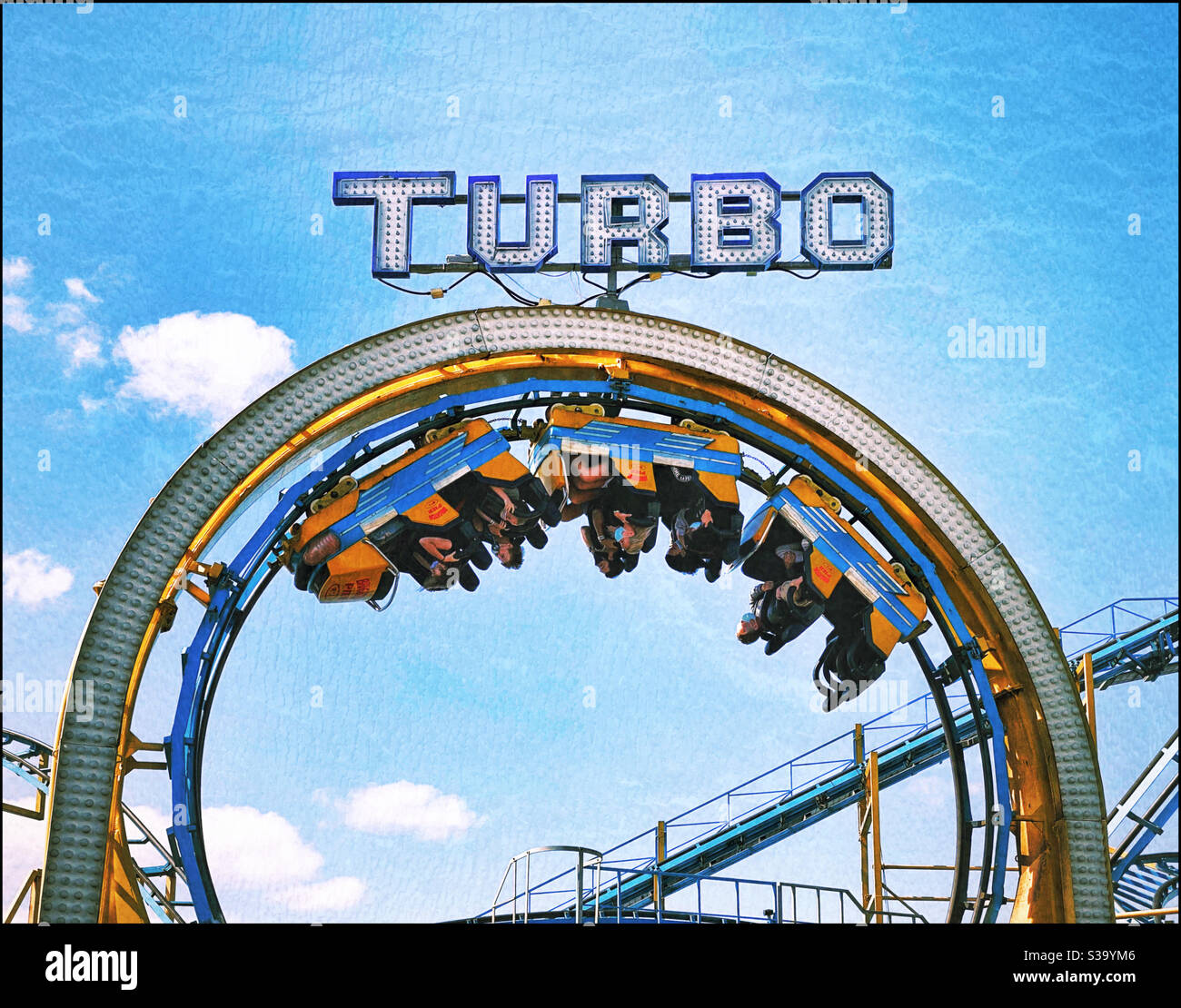 All the fun at the fun fair - travelling upside down on a roller coaster. Turbo power! Gravity defying!! Photo Credit - ©️ COLIN HOSKINS. - Smartphone Captured Stock Image