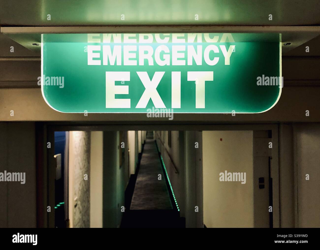 Emergency exit sign Stock Photo - Alamy