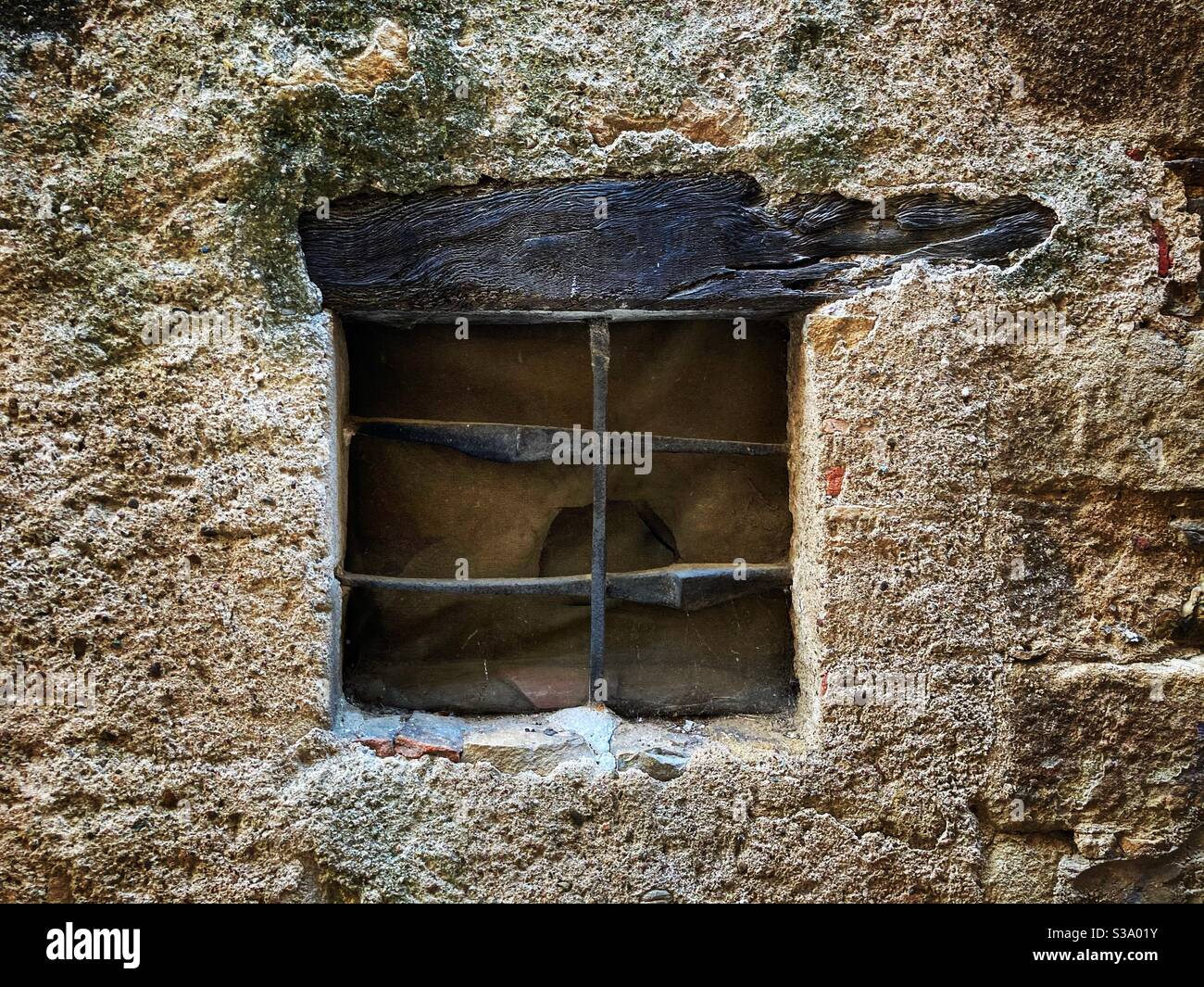 Closed window with a grid in the medieval village of Peratallada, located in the middle of the Emporda region of Girona, Catalonia, Spain Stock Photo