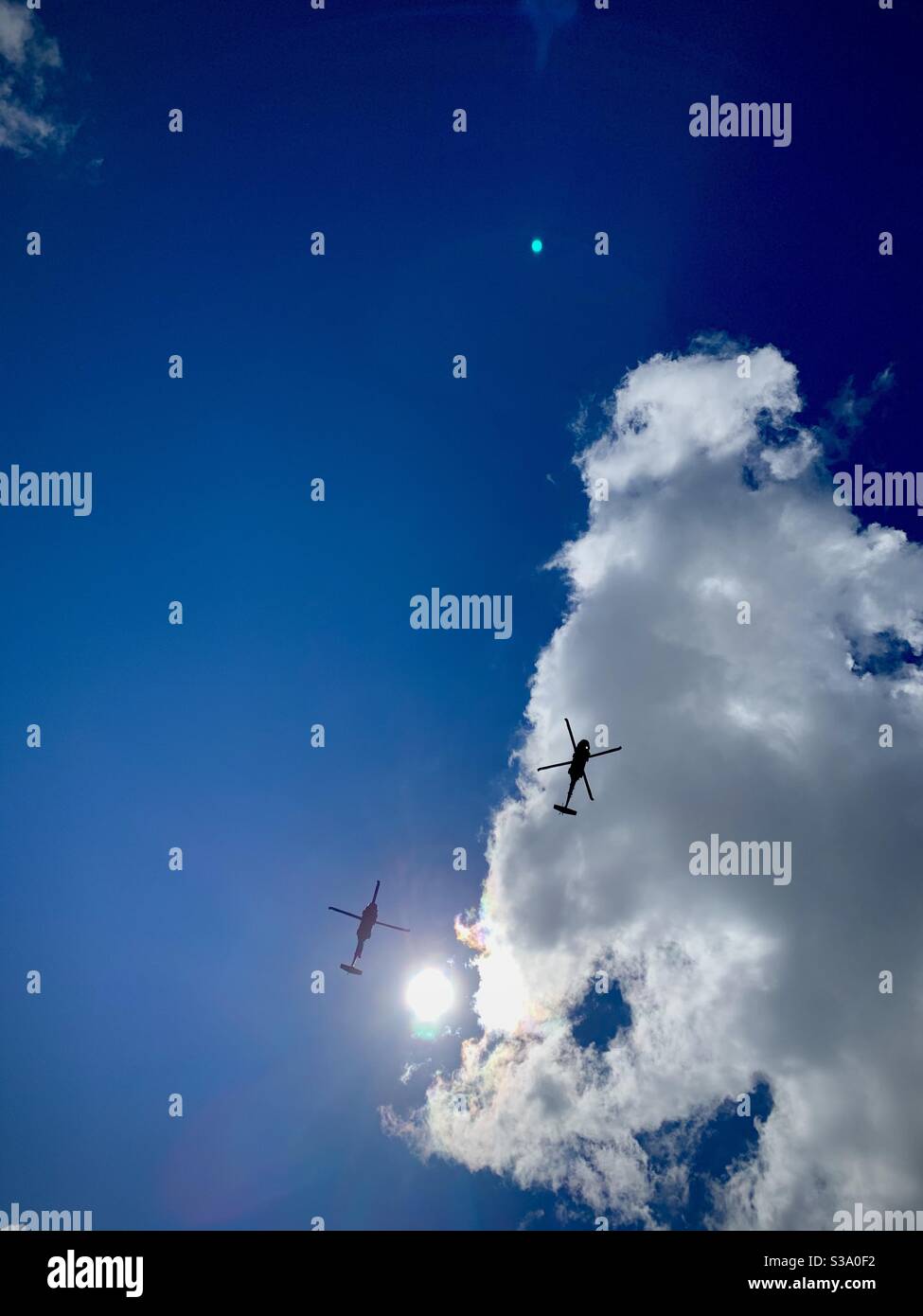 Two military helicopters fly hi-res stock photography and images - Alamy