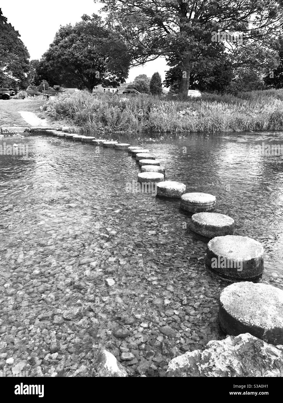 Stepping stones across a river - Smartphone Captured Stock Image